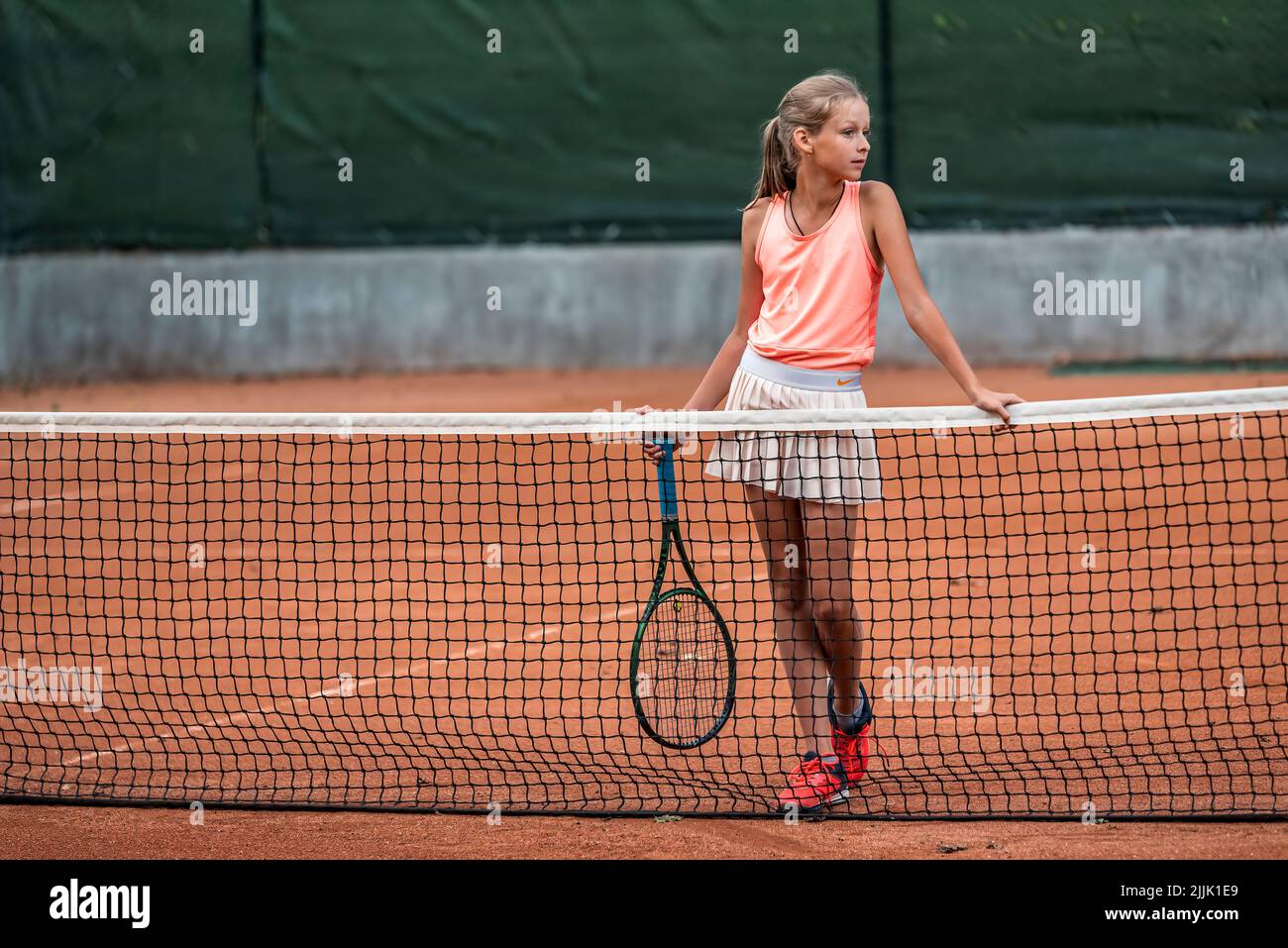 tennis girl player training in summer day in park Stock Photo