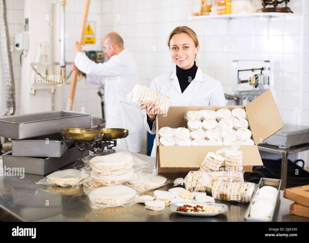 Workers kipping turron in food manufacture Stock Photo