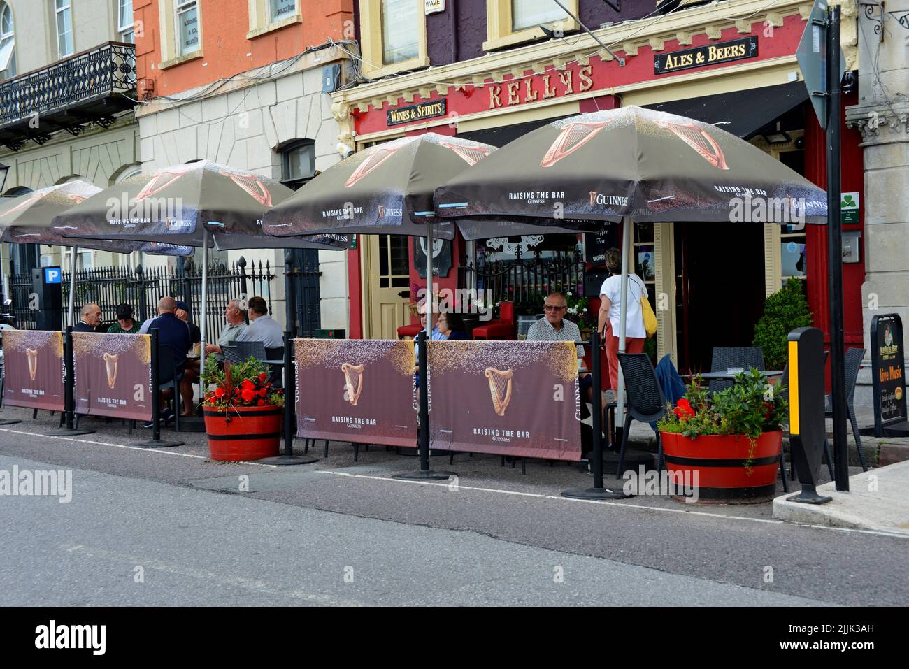 People drinking & dining outside Kellys traditional Irish bar in Cobh