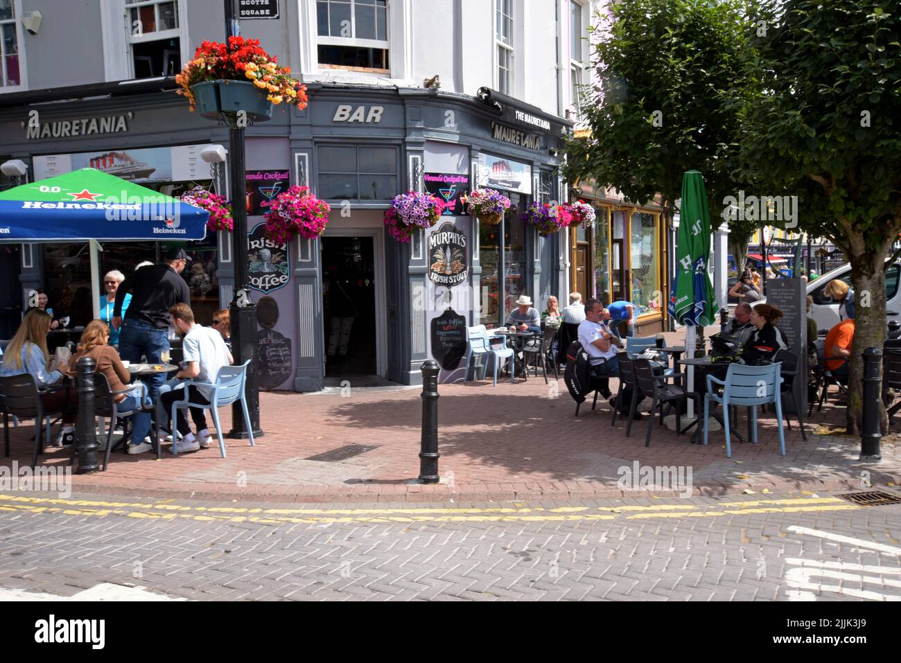 People drinking & dining outside the Mauretania traditional Irish bar
