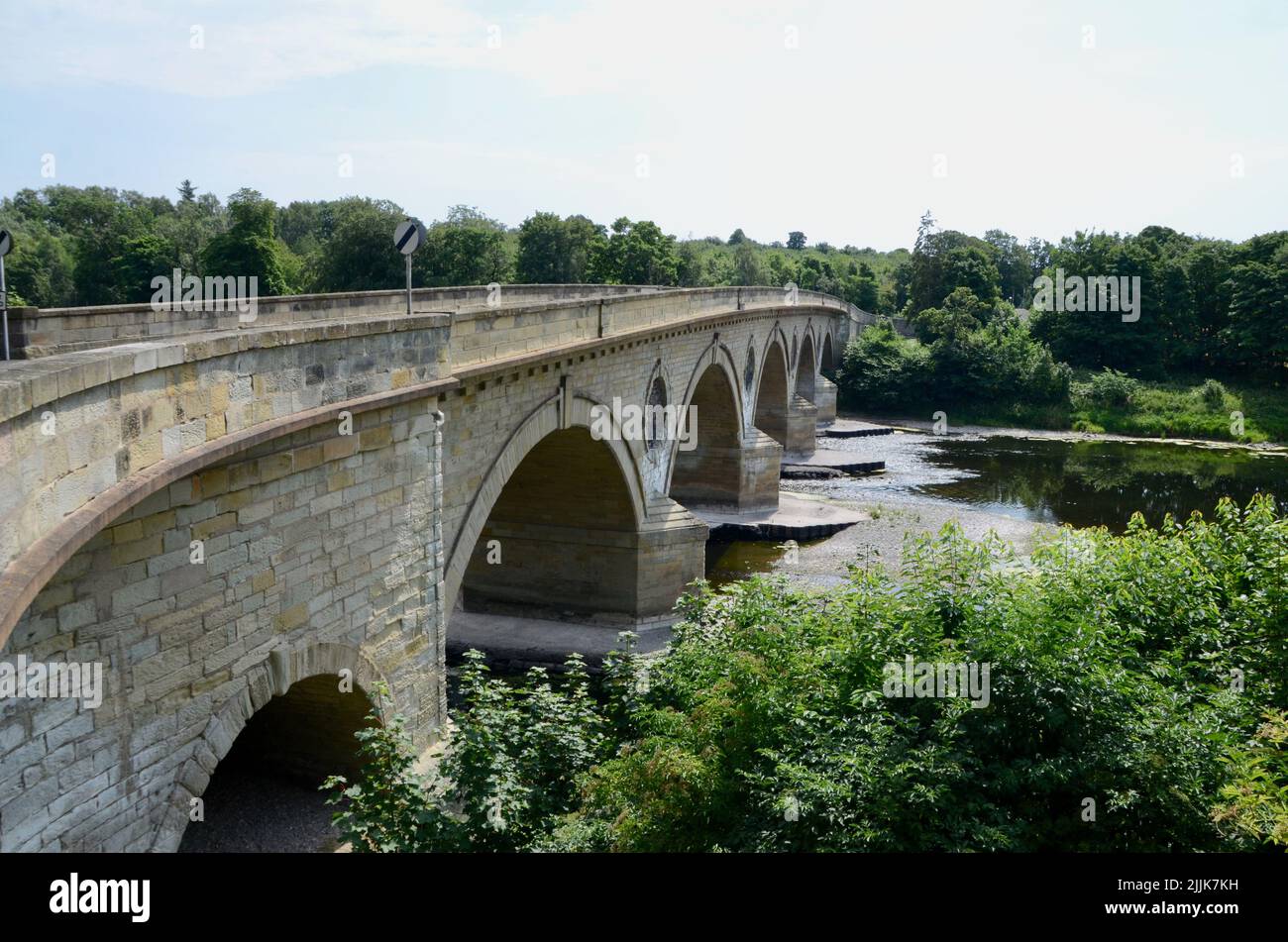 historic coldstream bridge on river tweed on england and scotland border in summer 2022 UK Stock Photo