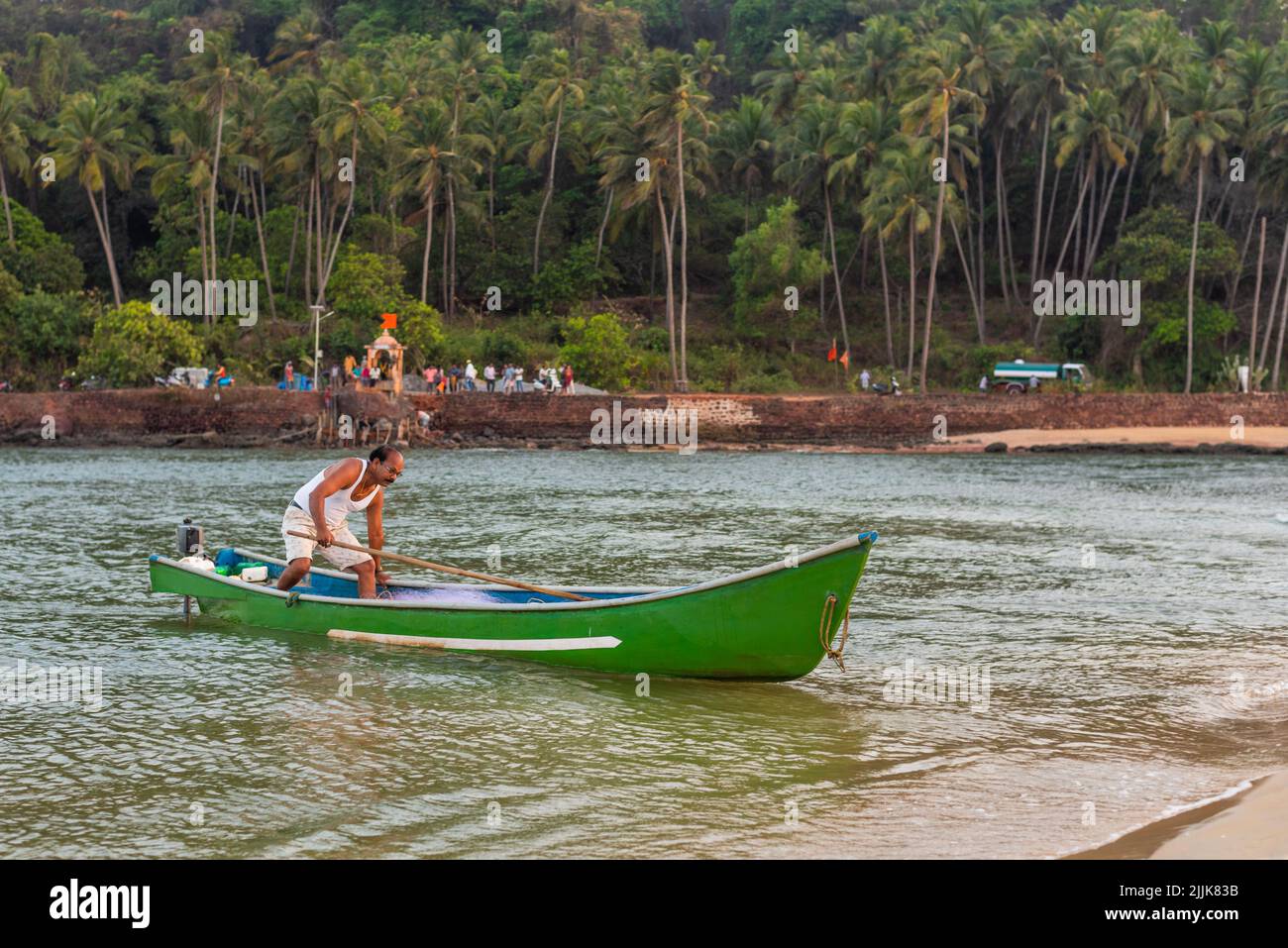 A local Indian fisherman in a boat in the village of Betul, Salcete, Goa, India Stock Photo