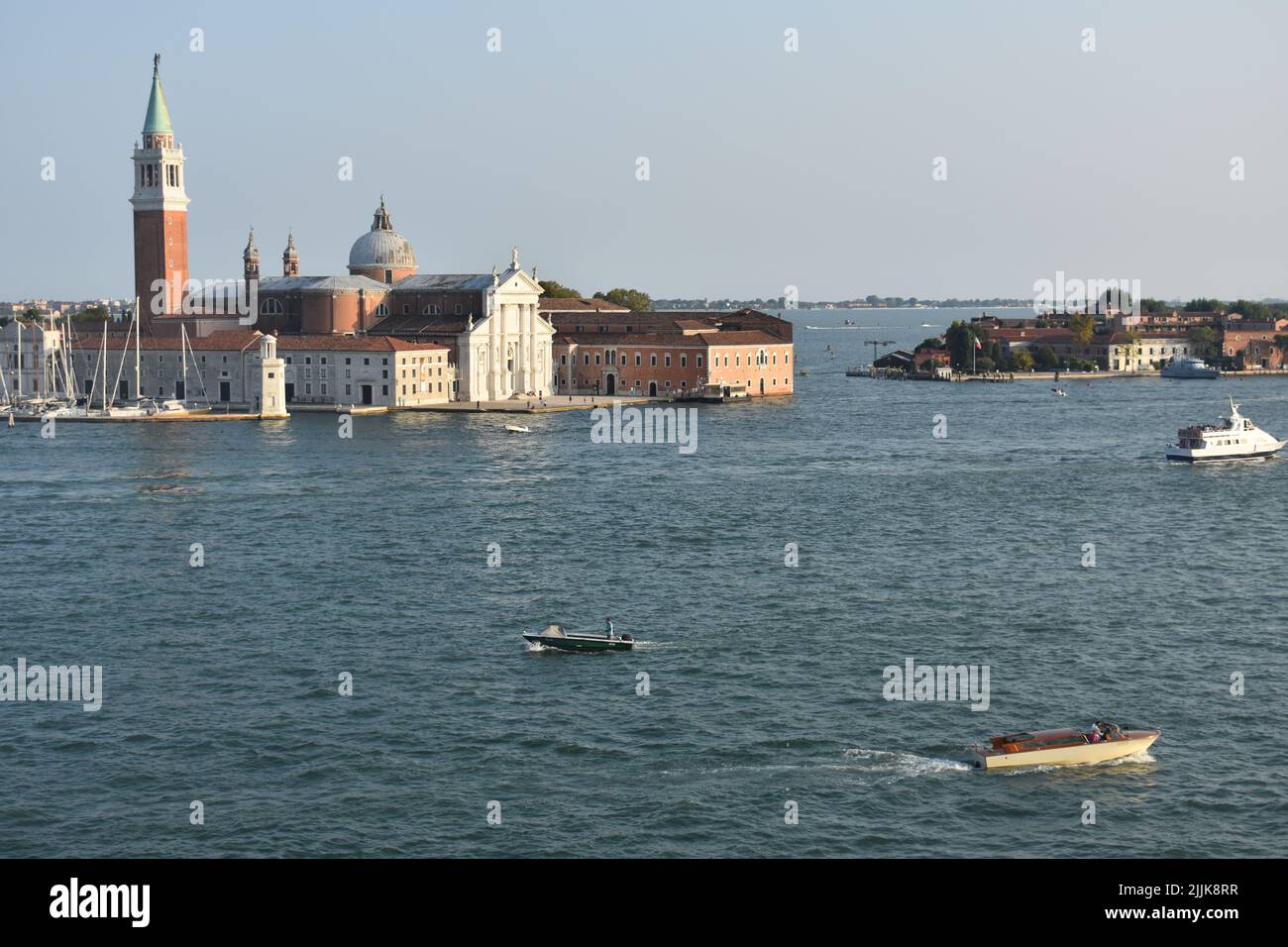 A scenic view of boats and architecture at the Venetian Lagoon,  Venice, Italy Stock Photo