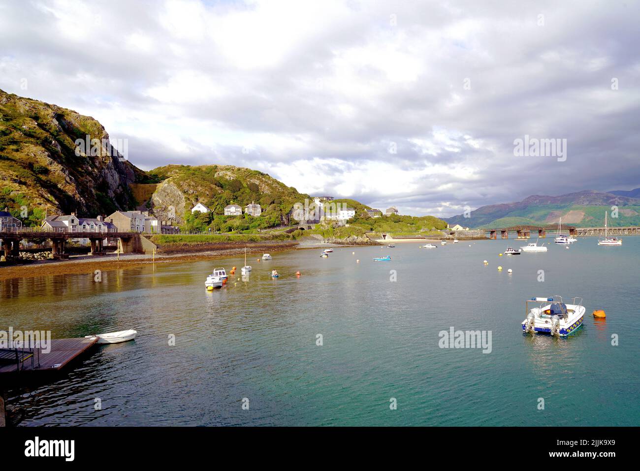 Barmouth harbour with storm clouds approaching from the mountains of Cader Idris in Wales, July 2022. Stock Photo