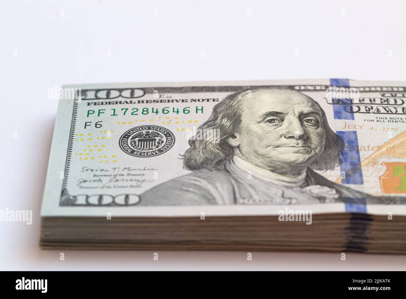 Pile of 100 dollar banknotes on white background for design purpose ...