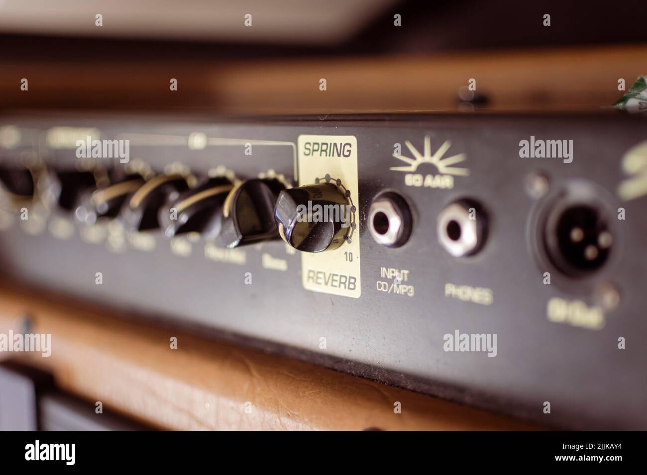 Guitar amp with reverb switch and inputs in focus. Stock Photo