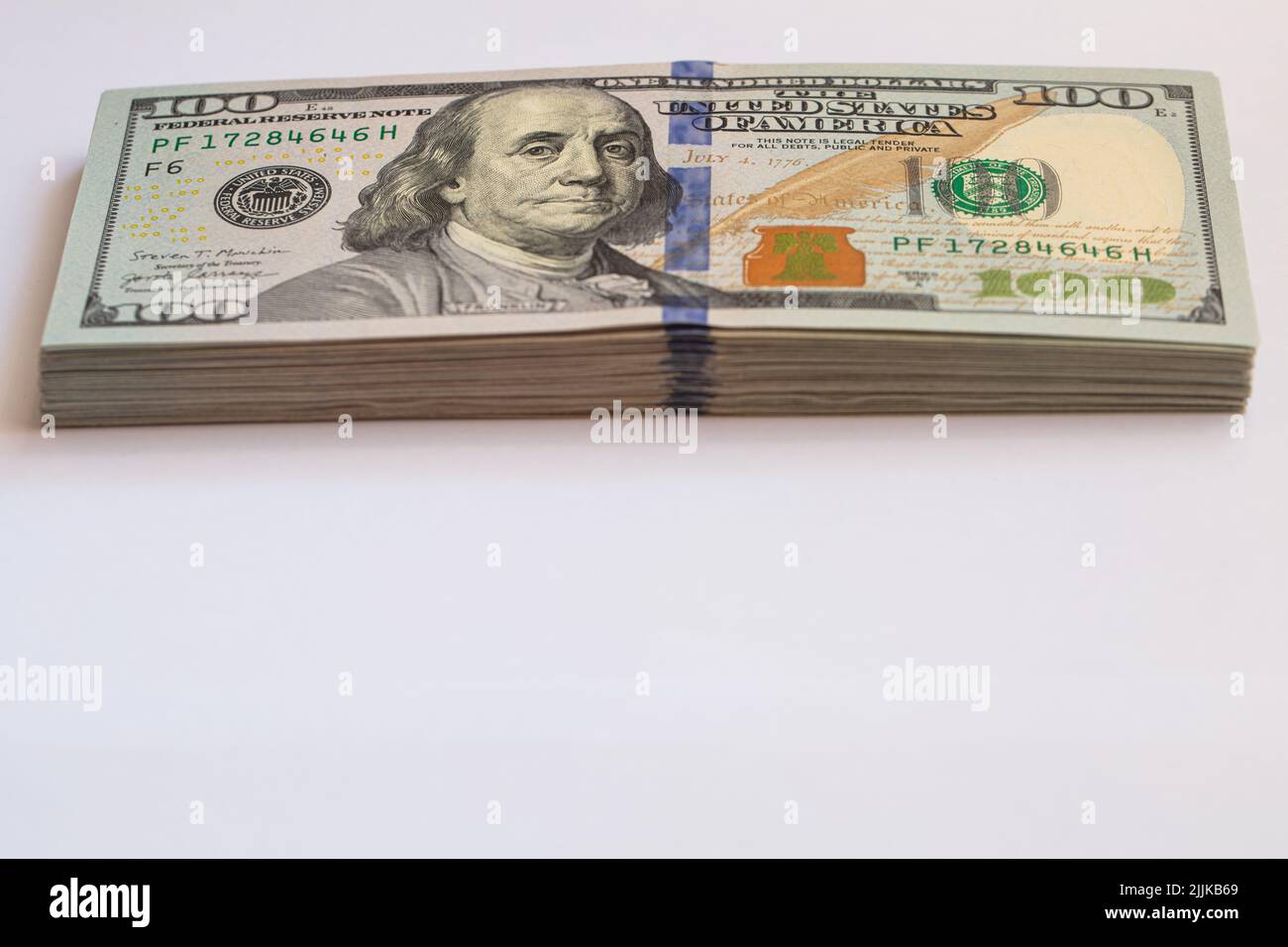 Pile of 100 dollar banknotes on white background for design purpose ...