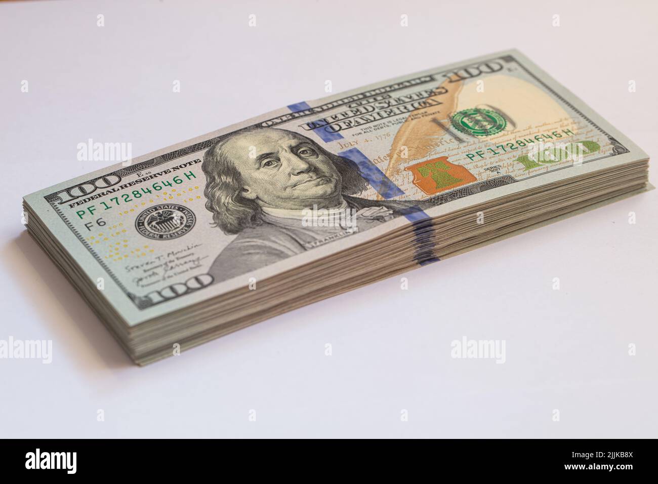 Pile of 100 dollar banknotes on white background for design purpose ...