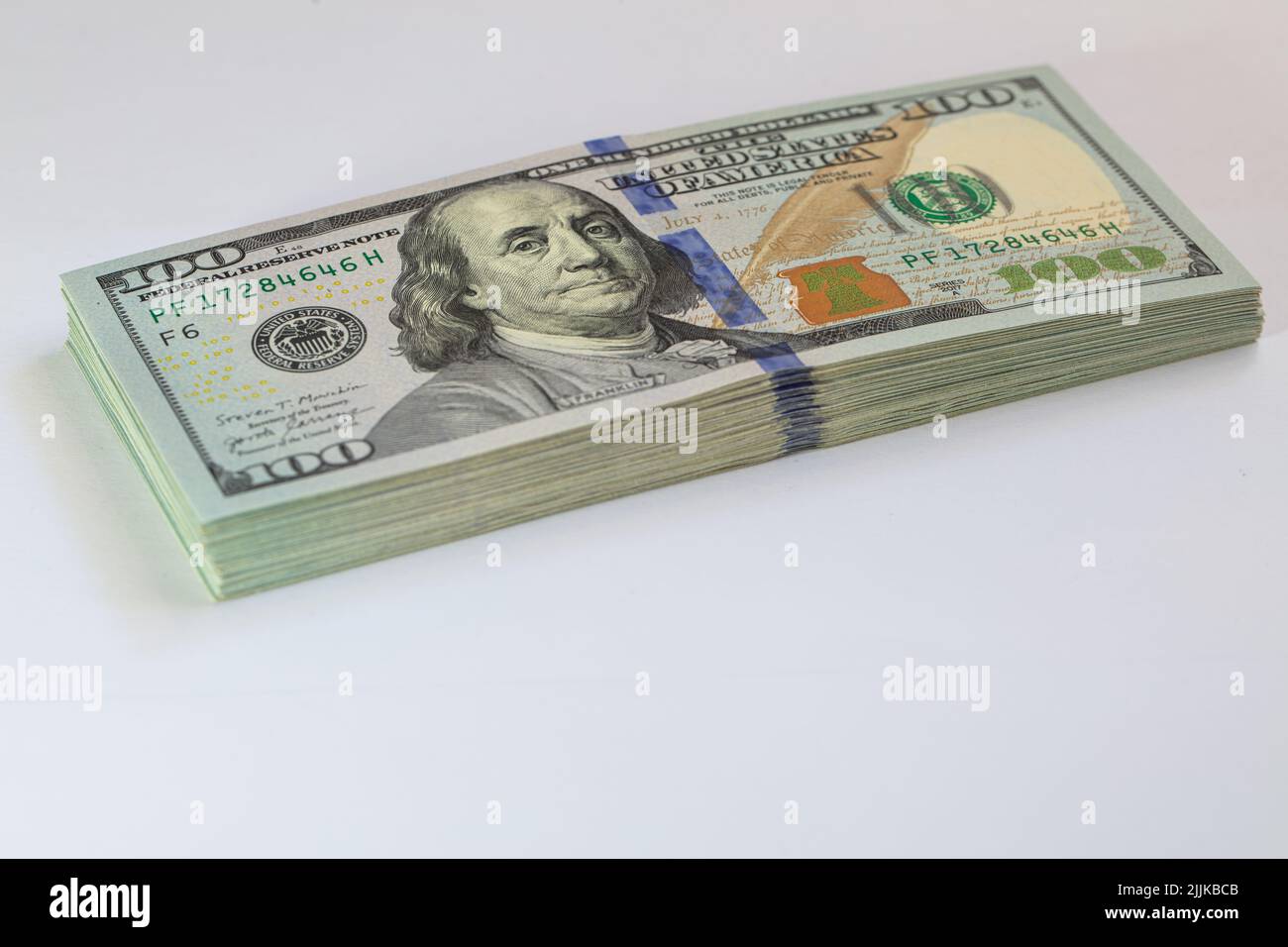 Pile of 100 dollar banknotes on white background for design purpose ...