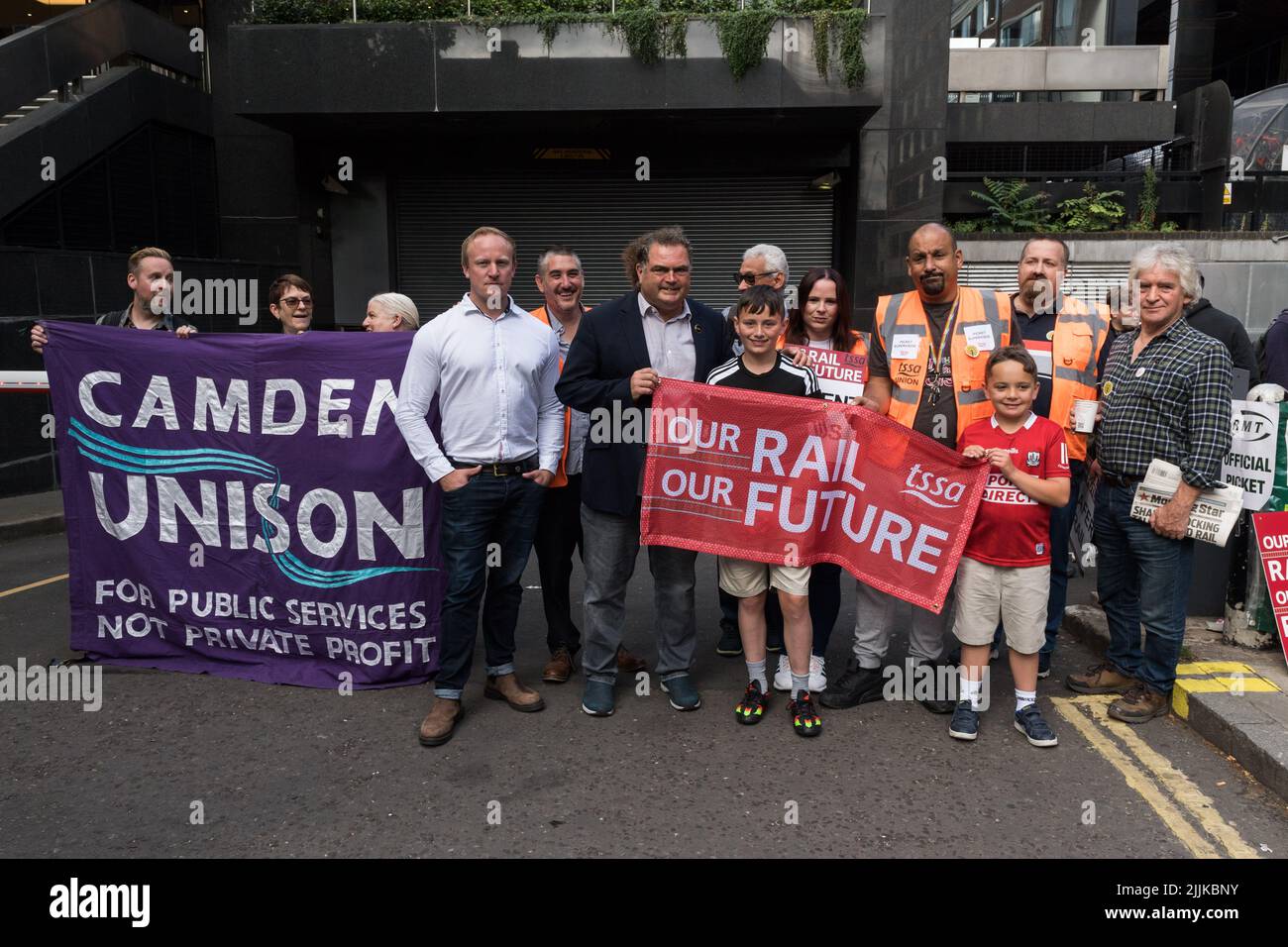 London, UK. 27th July, 2022. Shadow Transport Minister Sam Tarry (4L) joins RMT picket line outside Euston Station as railway workers stage a 24-hour walk-out. More than 40,000 workers from 14 train operating companies and Network Rail are taking part in the industrial action, called by the RMT (The National Union of Rail, Maritime and Transport Workers), as part of an ongoing dispute over pay, jobs and conditions following three days of strikes in June. Credit: Wiktor Szymanowicz/Alamy Live News Stock Photo