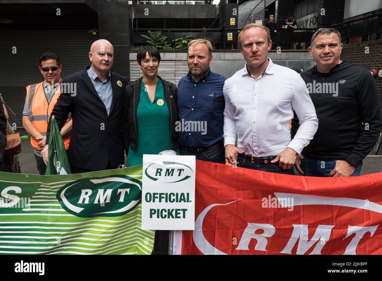 London, UK. 27th July, 2022. General Secretary of the National Union of Rail, Maritime and Transport Workers (RMT) Mick Lynch (2L) and Shadow Transport Minister Sam Tarry (2R) join RMT picket line outside Euston Station as railway workers stage a 24-hour walk-out. More than 40,000 workers from 14 train operating companies and Network Rail are taking part in the industrial action, called by the RMT (The National Union of Rail, Maritime and Transport Workers), as part of an ongoing dispute over pay, jobs and conditions following three days of strikes in June. Credit: Wiktor Szymanowicz/Alamy Liv Stock Photo