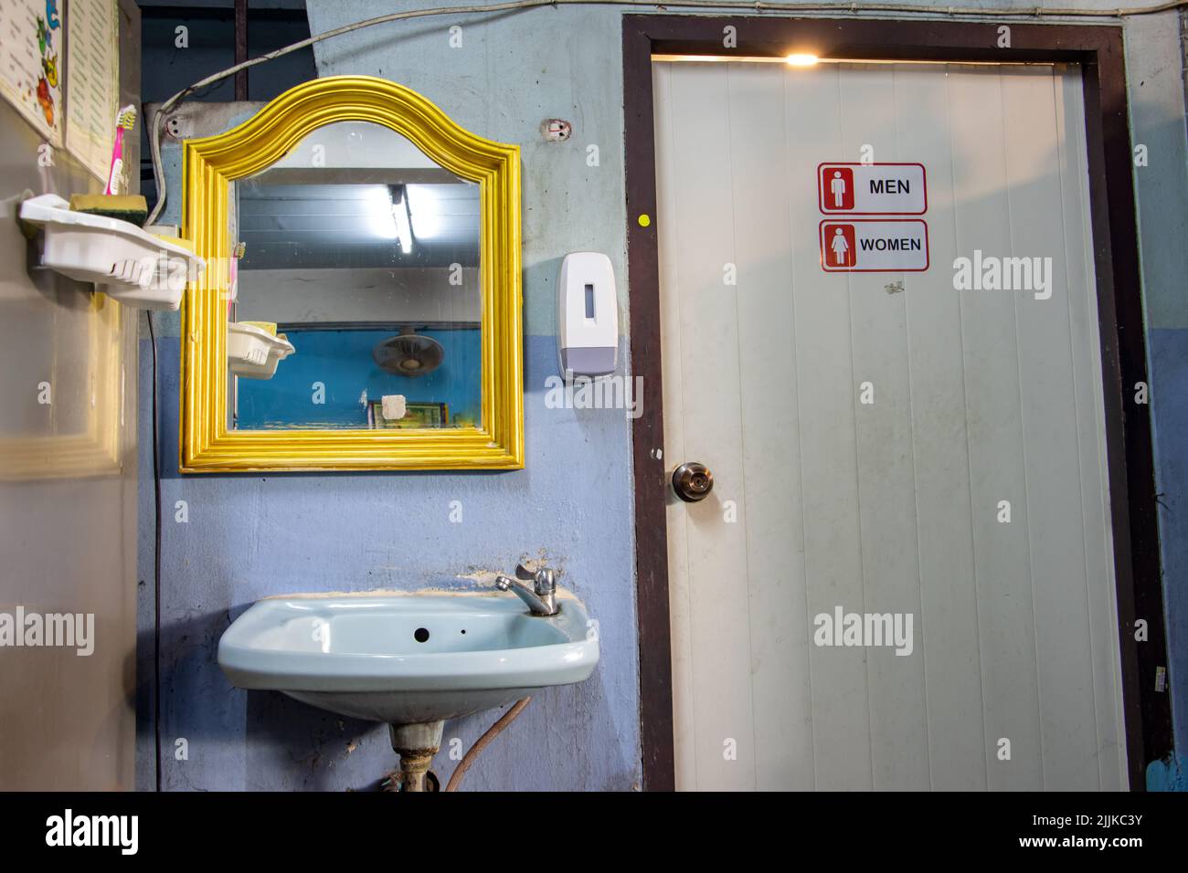 Public toilets with washroom in a cheap restaurant Stock Photo