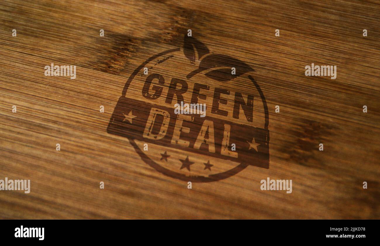 Green Deal stamp printed on wooden box. European Fit for 55 and reduce the greenhouse gas emissions concept. Stock Photo