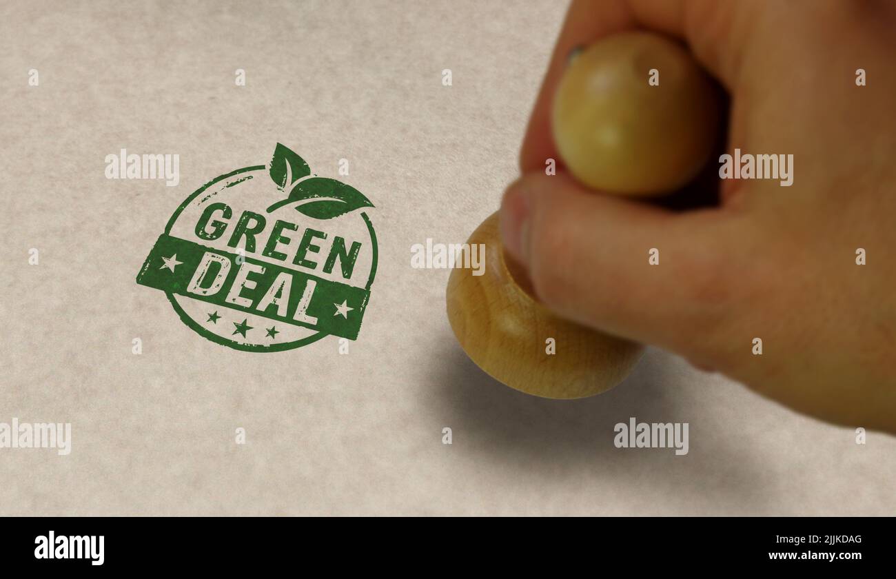 Green Deal stamp and stamping hand. European Fit for 55 and reduce the greenhouse gas emissions concept. Stock Photo
