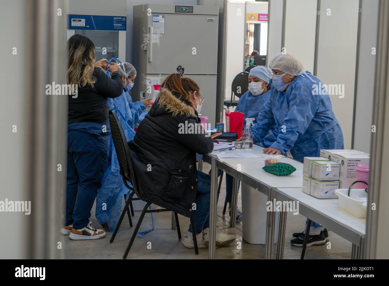 A closeup of people waiting in vaccination to be inoculated Stock Photo