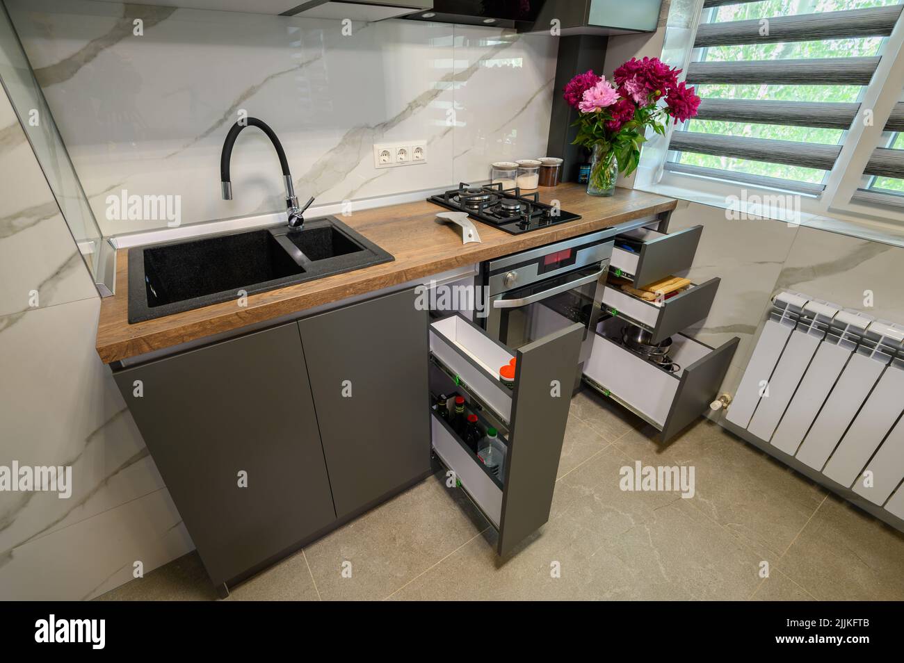 Interior of modern trendy grey kitchen Stock Photo - Alamy