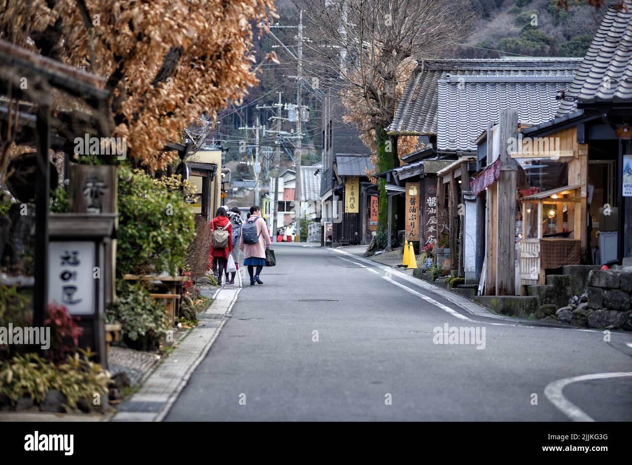 The people walking down a narrow street in Yufuin, Japan Stock Photo