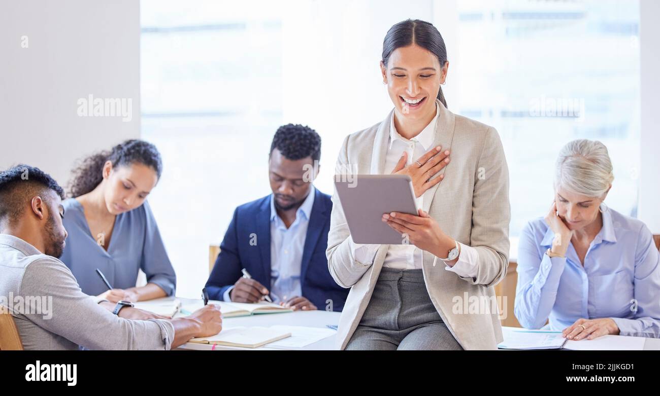 Together we will prevail. a confident young businesswoman working in a modern office. Stock Photo