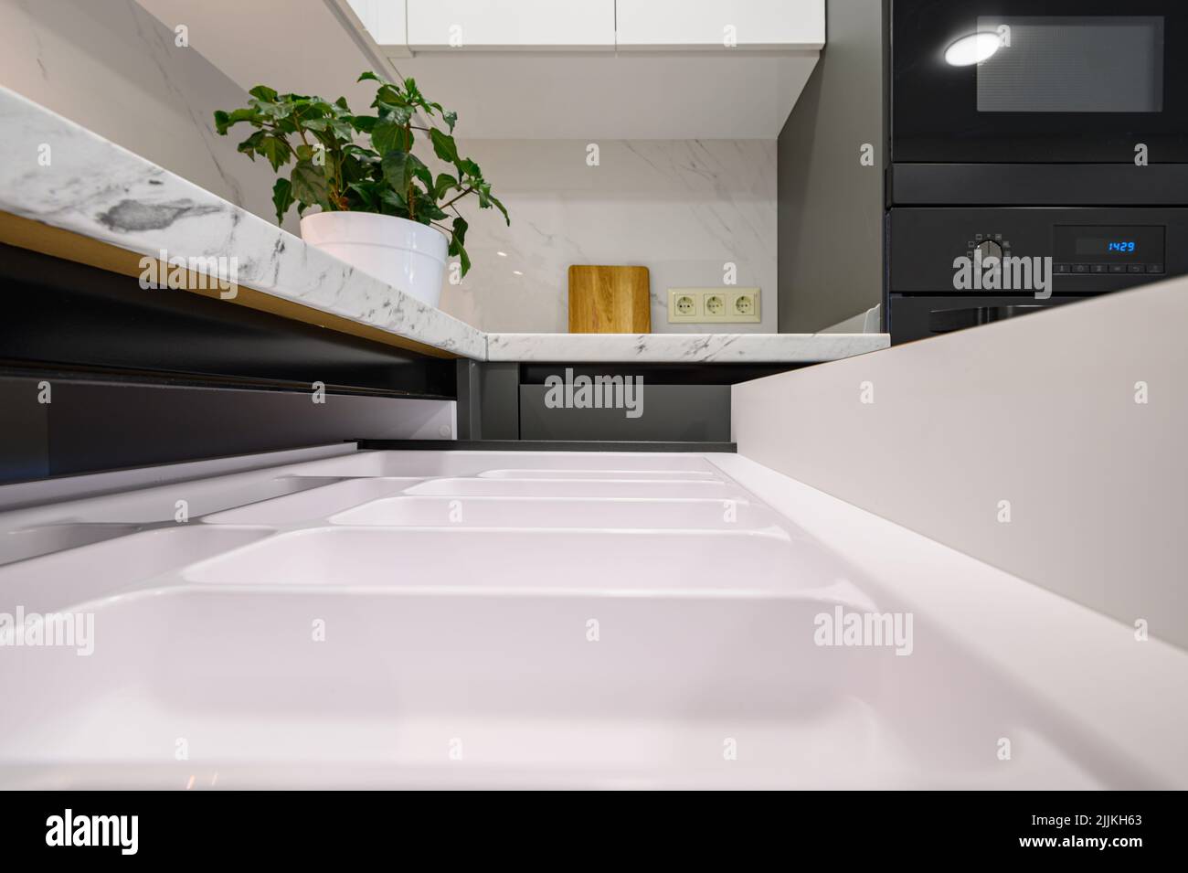 Marble worktop of modern white and dark grey kitchen Stock Photo Alamy