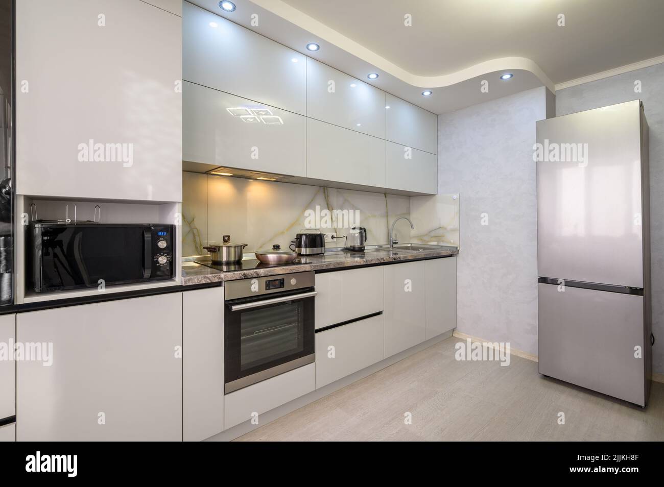 Interior of modern trendy white kitchen Stock Photo Alamy