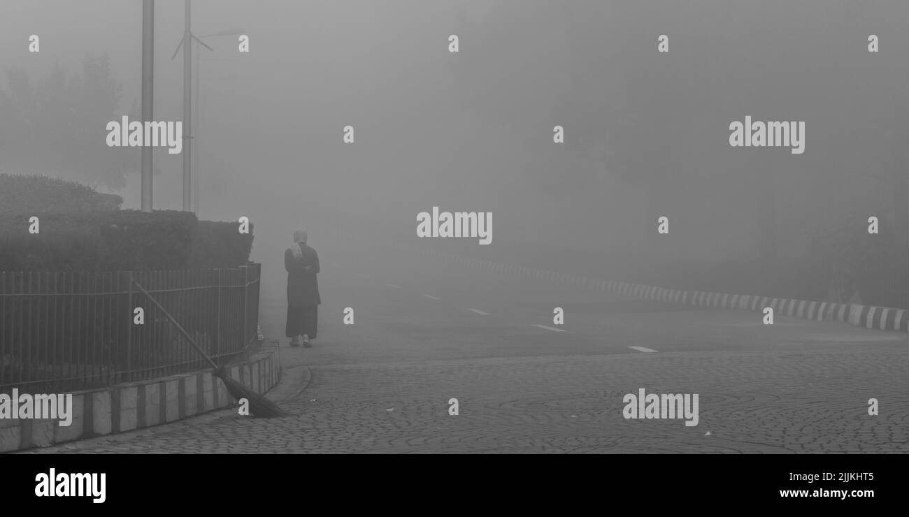 A man fading in a mist and fogy Stock Photo