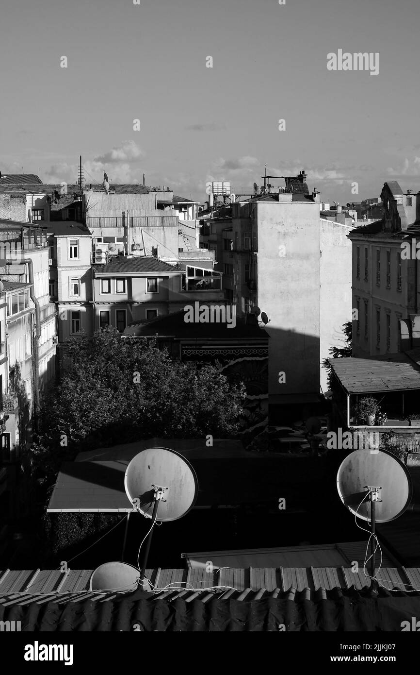 A vertical grayscale shot of buildings in daylight Stock Photo - Alamy