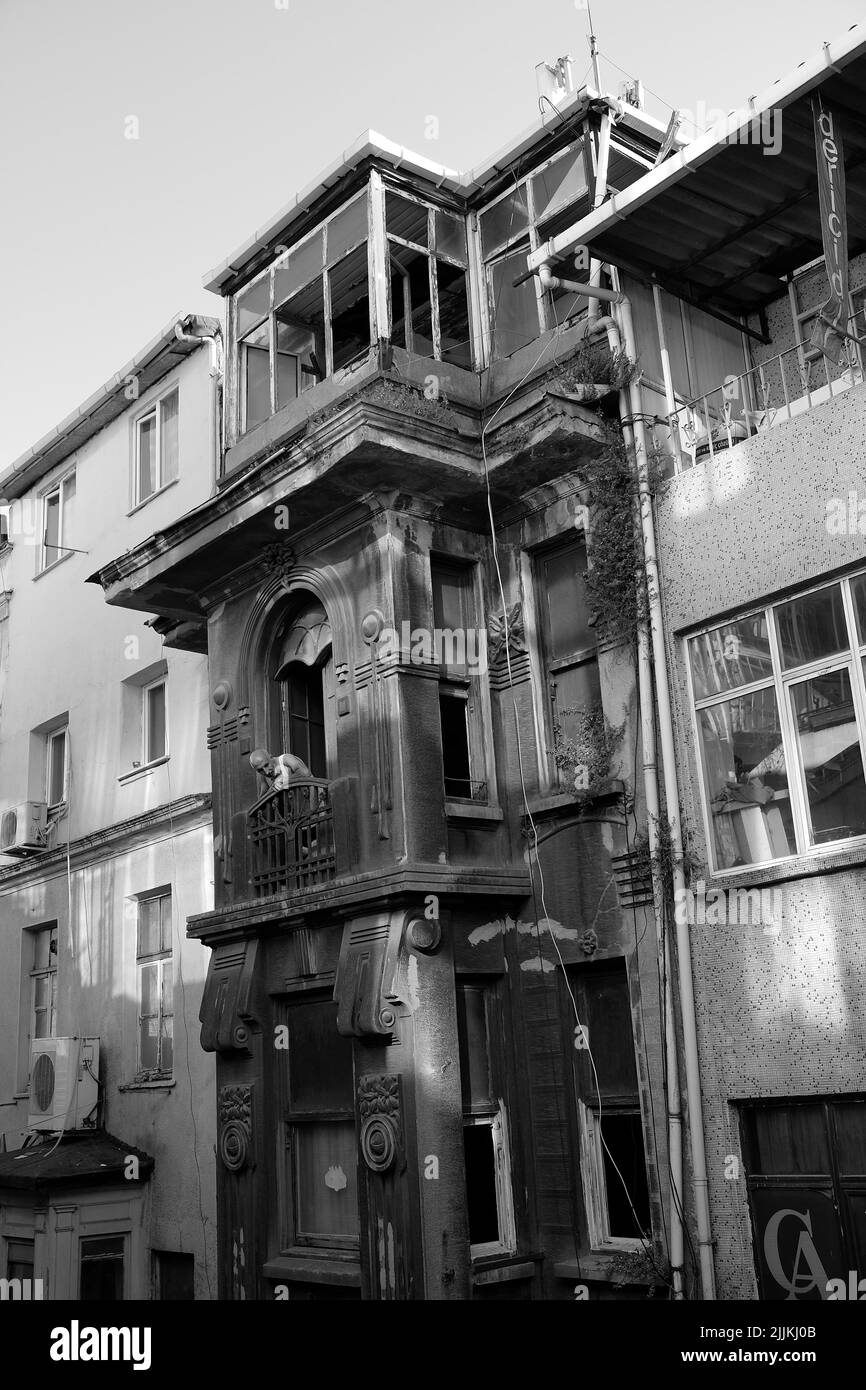 A vertical greyscale shot an old apartment Stock Photo