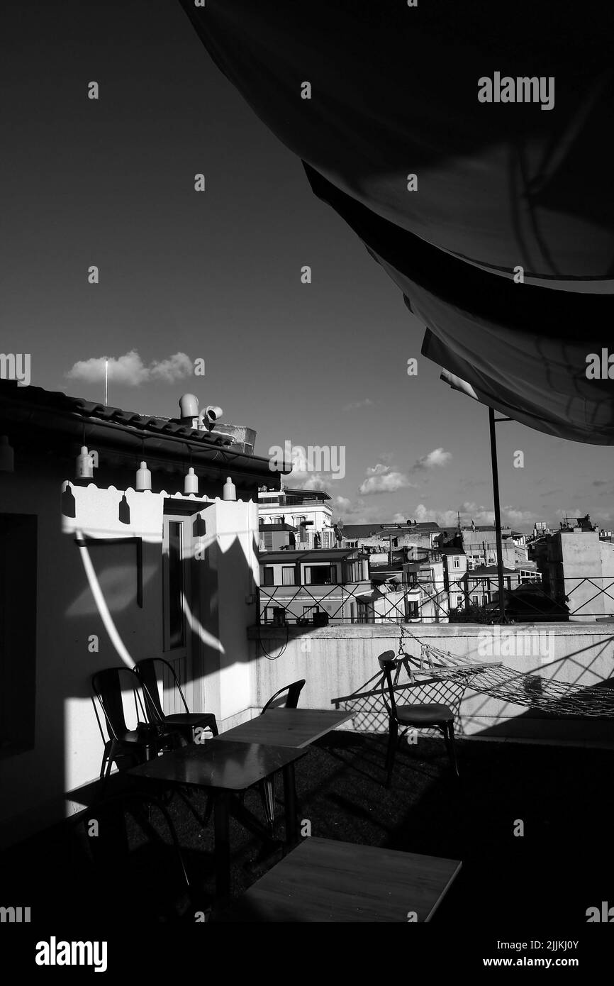 A vertical greyscale shot of a cafe in the rooftop Stock Photo Alamy