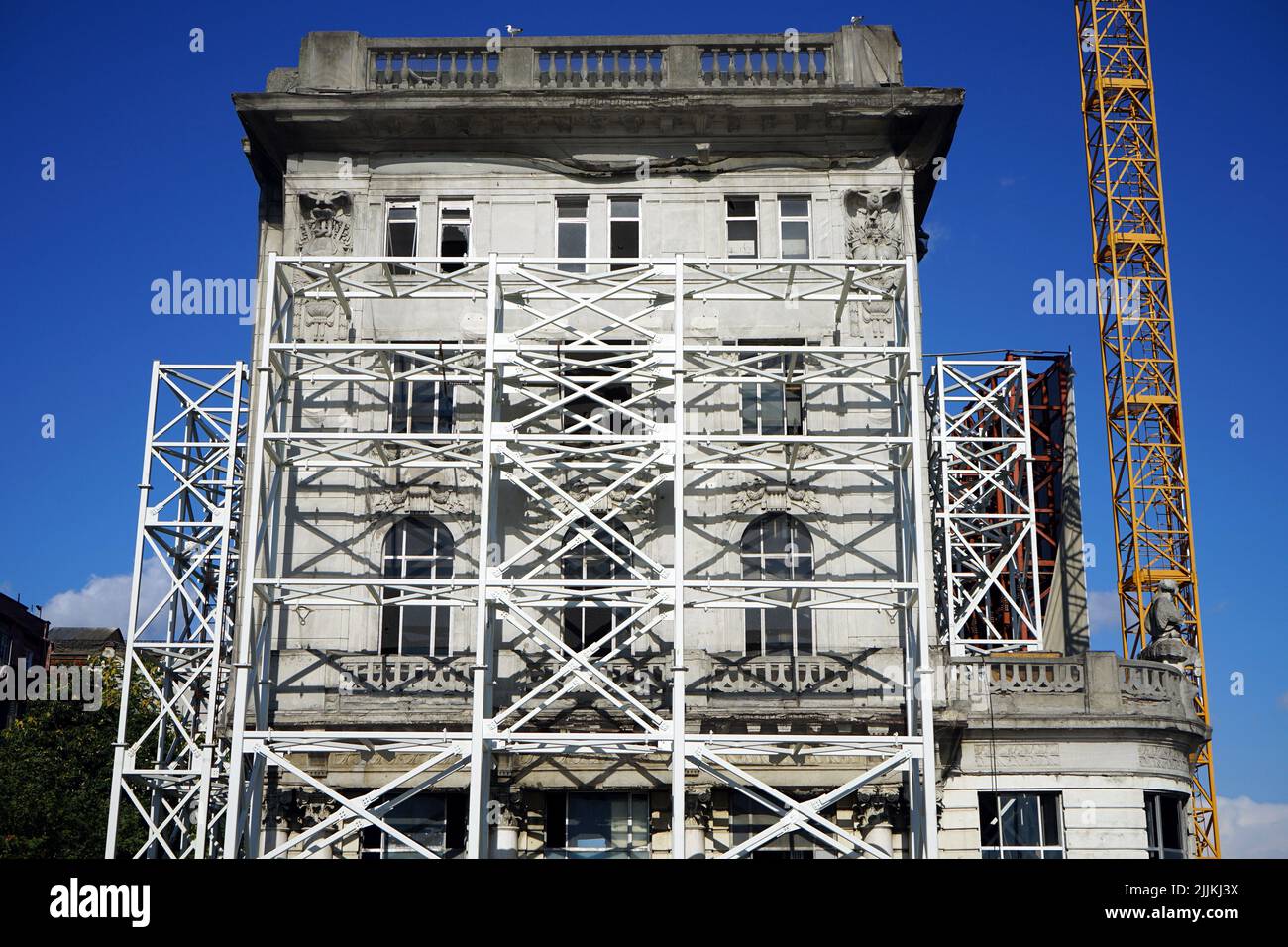 A front view of a building facade in the construction process Stock
