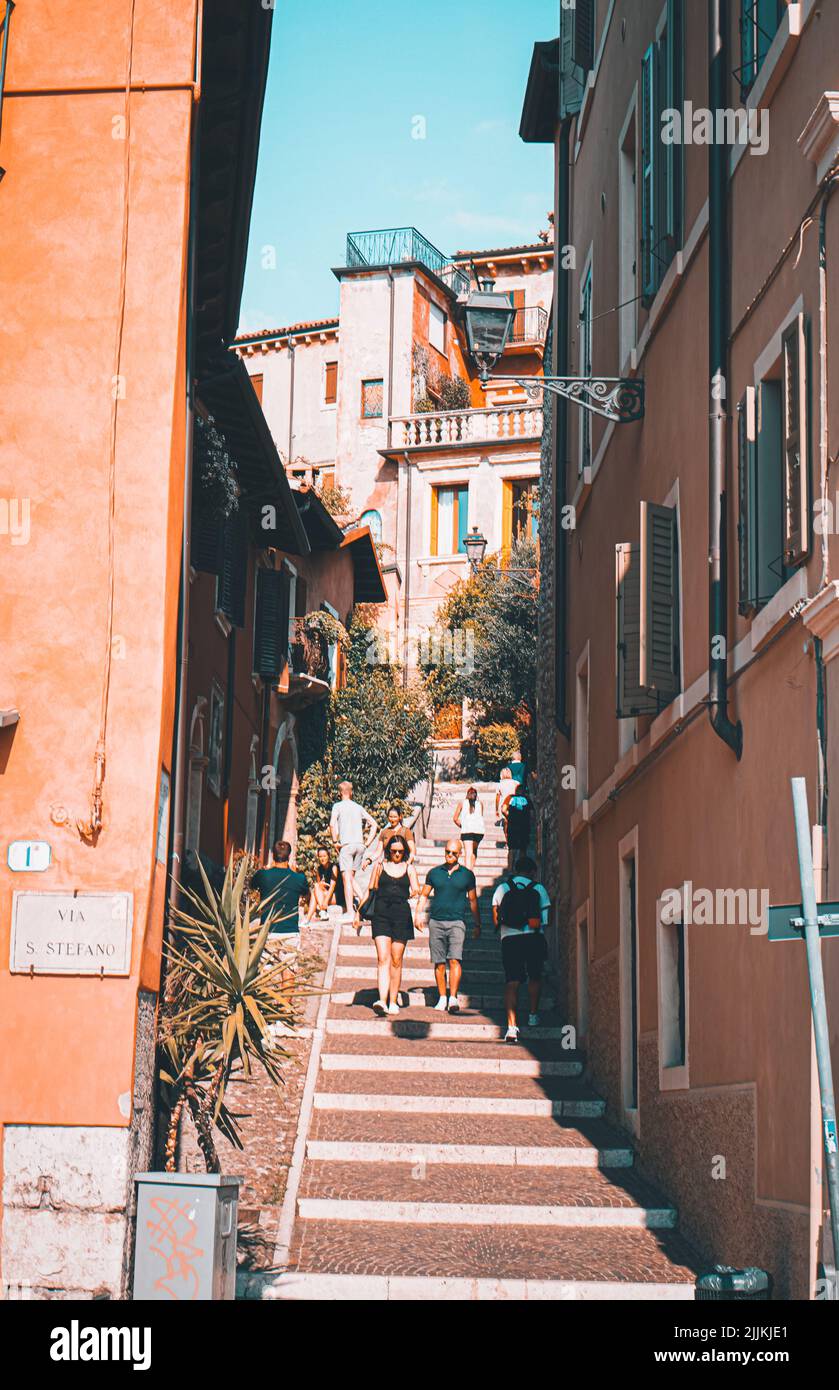 A vertical shot of a busy stairway of a street in Verona, Italy in spring or summer Stock Photo