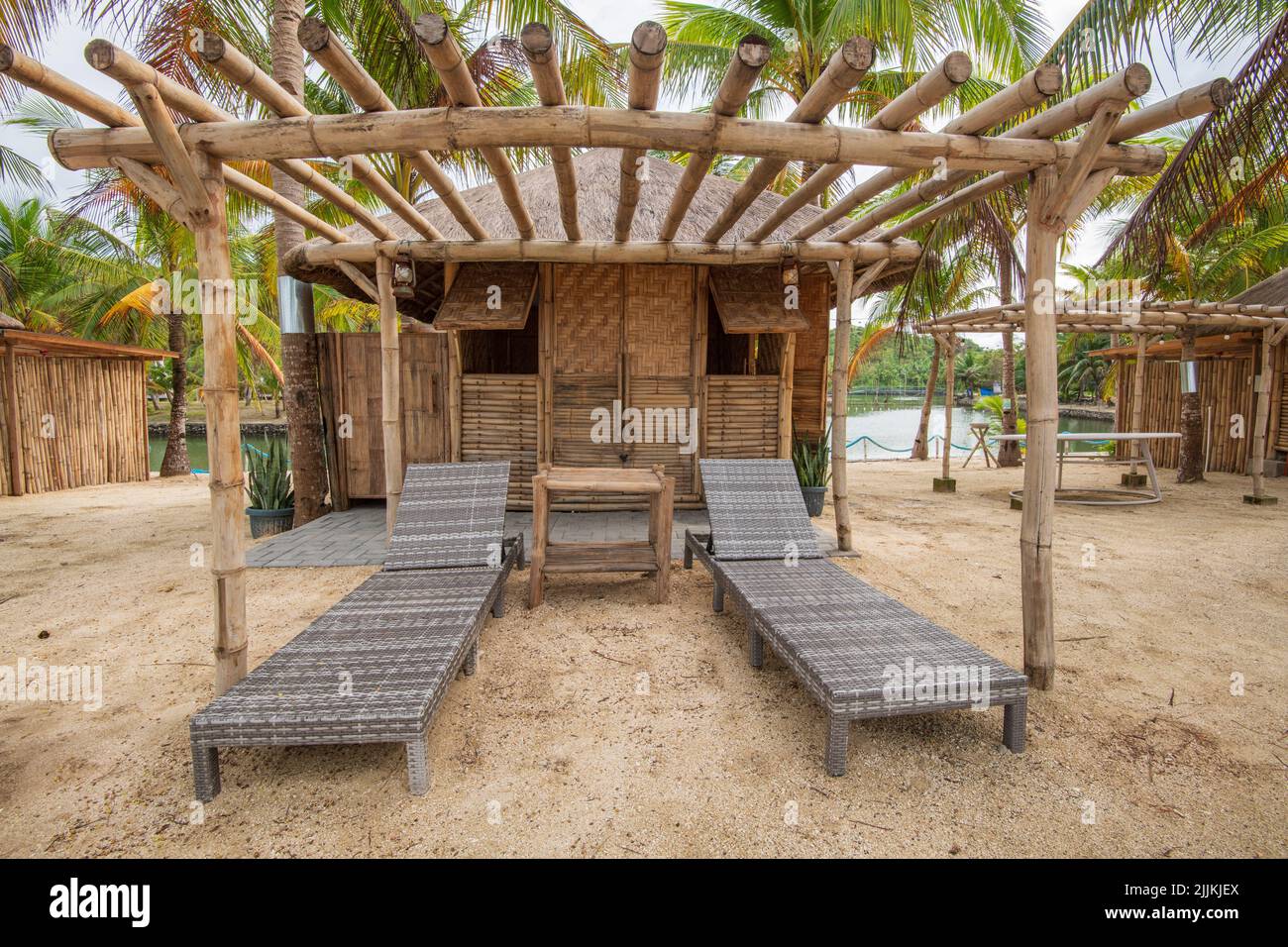 A tropical beach and deck chairs for relax Stock Photo Alamy