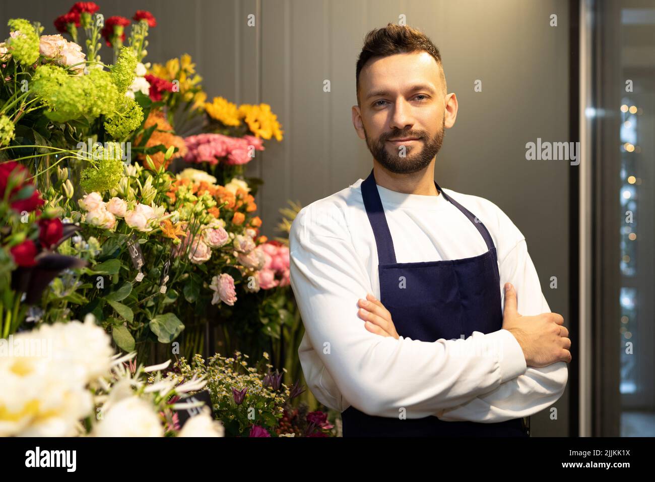 sole trader sells fresh flowers and potted plants Stock Photo Alamy