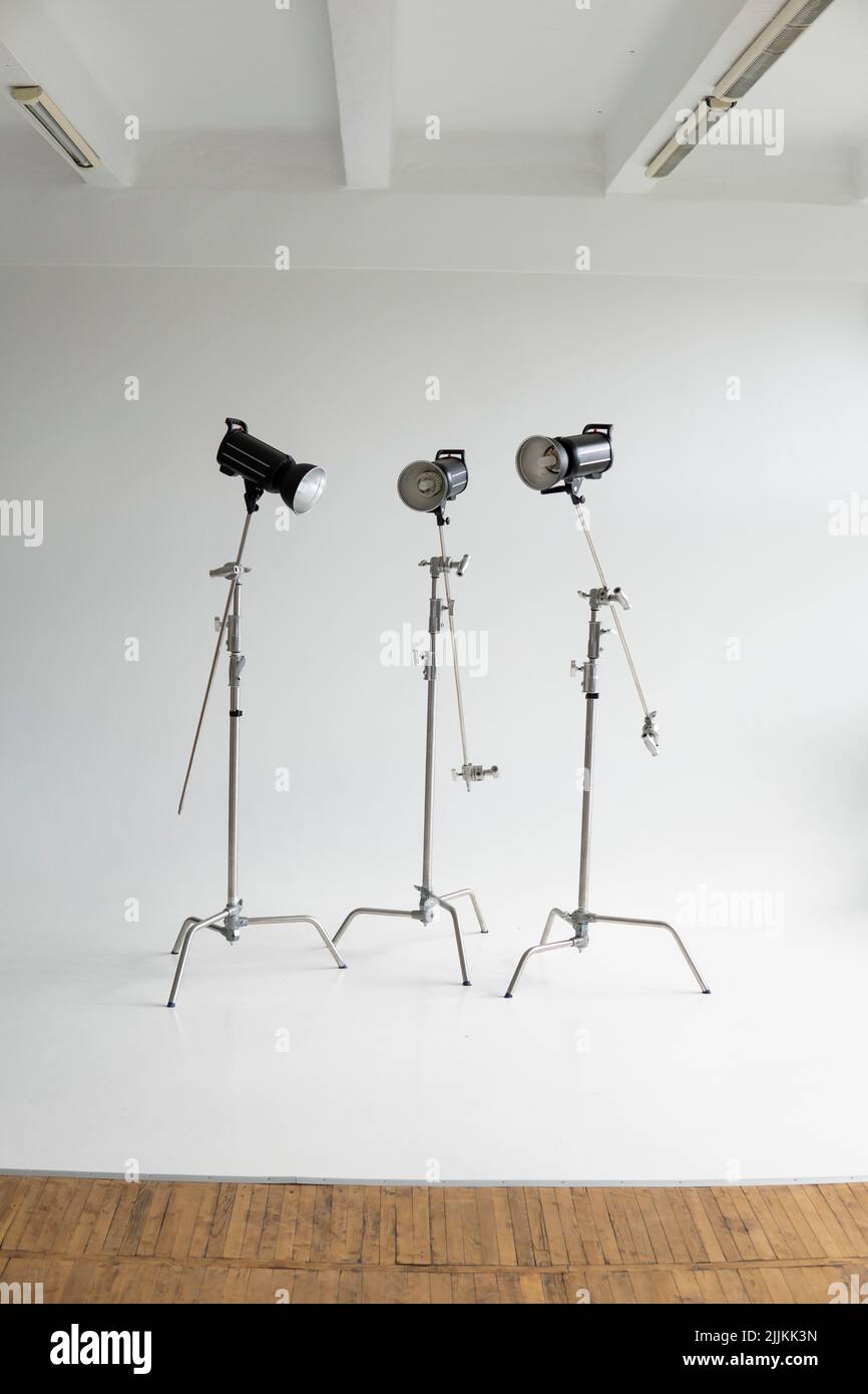 Empty photo studio with lighting equipment. Professional camera, lenses and  filters for photographer Stock Photo - Alamy