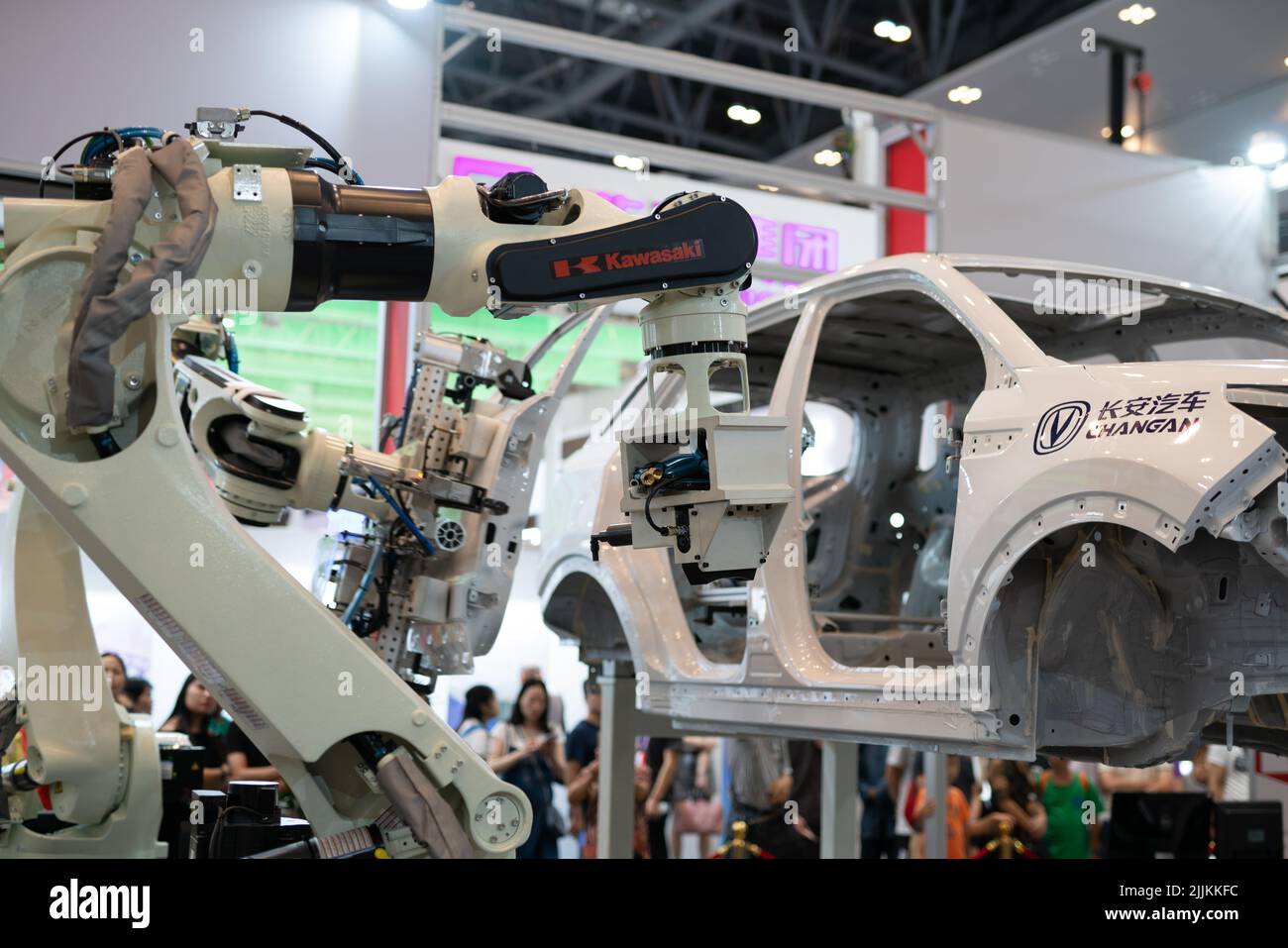 A Robot arm display working on a car in the Smart China Expo in Chongqing, China Stock Photo