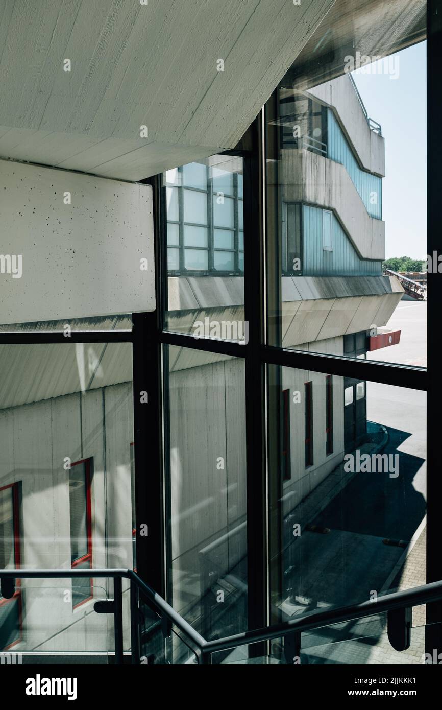 A view of a modern building through big glass windows Stock Photo - Alamy