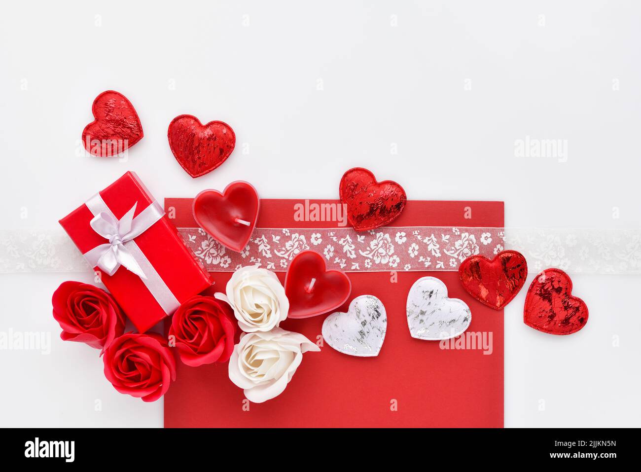 Valentines Day background. Red gift box with roses, ribbon and hearts ...