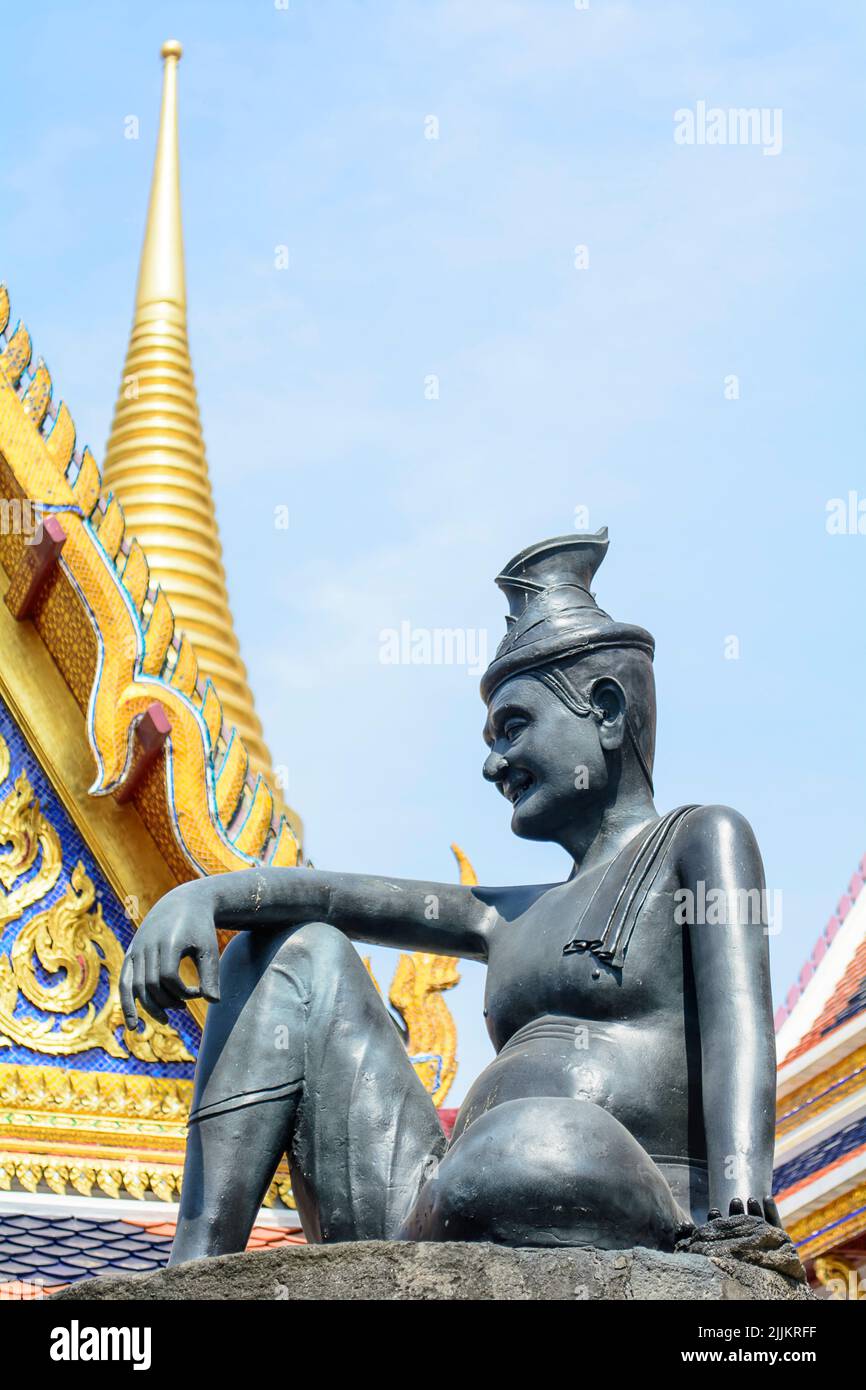 A religious statue in the Temple of the Emerald Buddha in Thailand Stock Photo