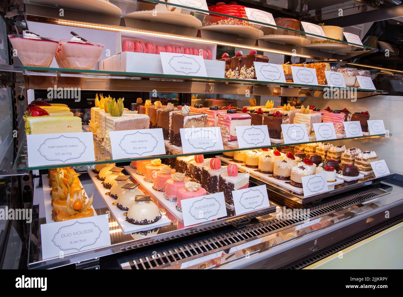 A showcase with sweet cakes and pastries Stock Photo Alamy