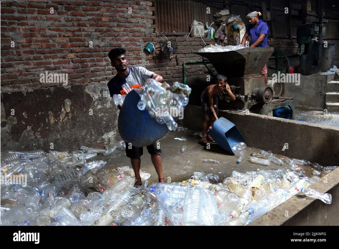 Works Work in a plastic bottle recycling factory in Dhaka, Bangladesh