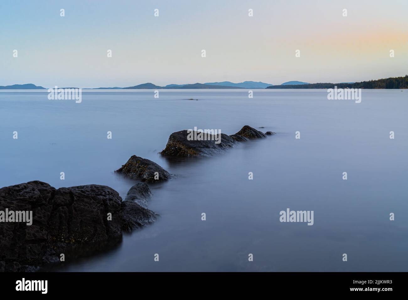 A beautiful view of rocks surrounded by fog in Nanaimo, BC, Canada Stock Photo