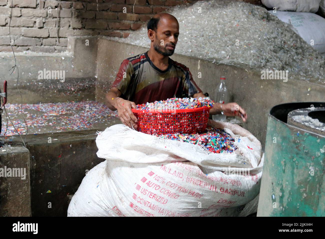 Works Work in a plastic bottle recycling factory in Dhaka, Bangladesh