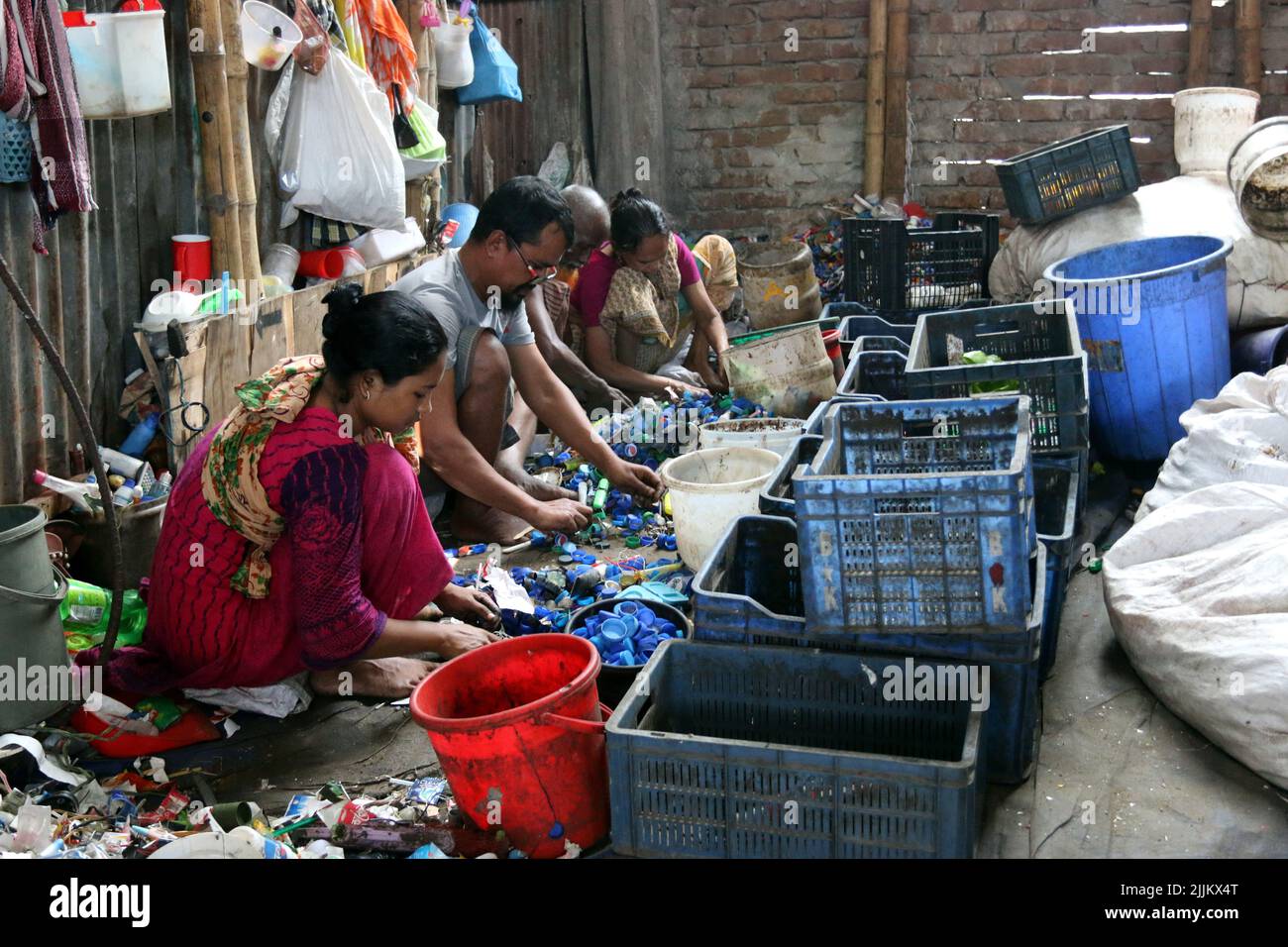 Works Work in a plastic bottle recycling factory in Dhaka, Bangladesh