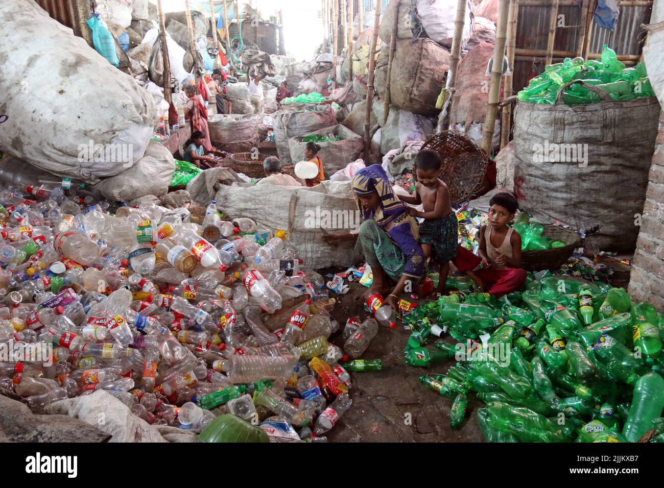 Works Work in a plastic bottle recycling factory in Dhaka, Bangladesh