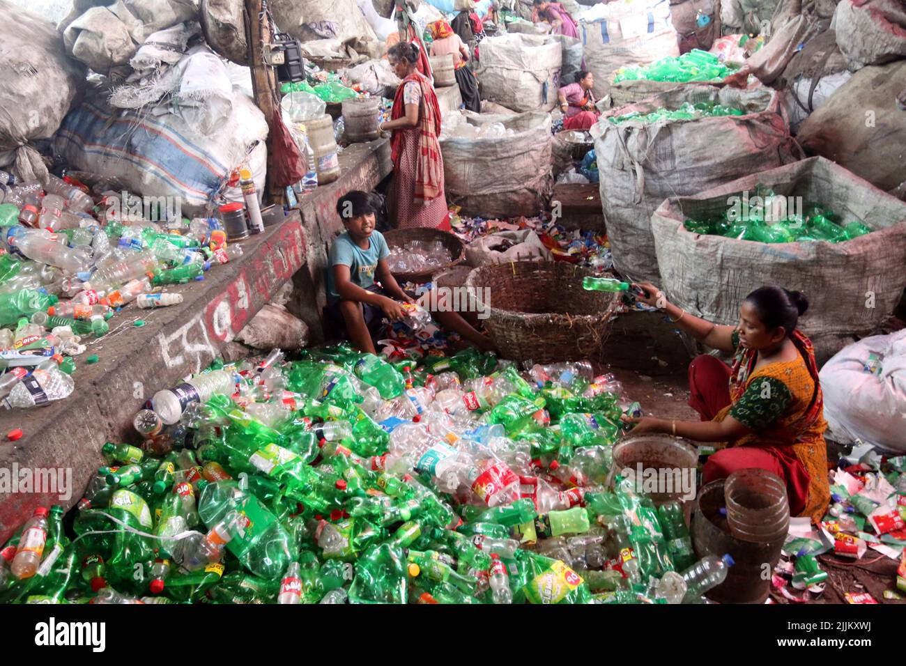 Works Work in a plastic bottle recycling factory in Dhaka, Bangladesh