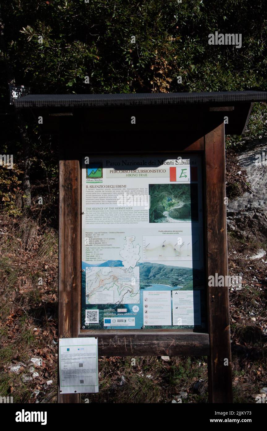 A vertical shot of a map leading to a park in Fiastra, Marche in a wooden frame Stock Photo