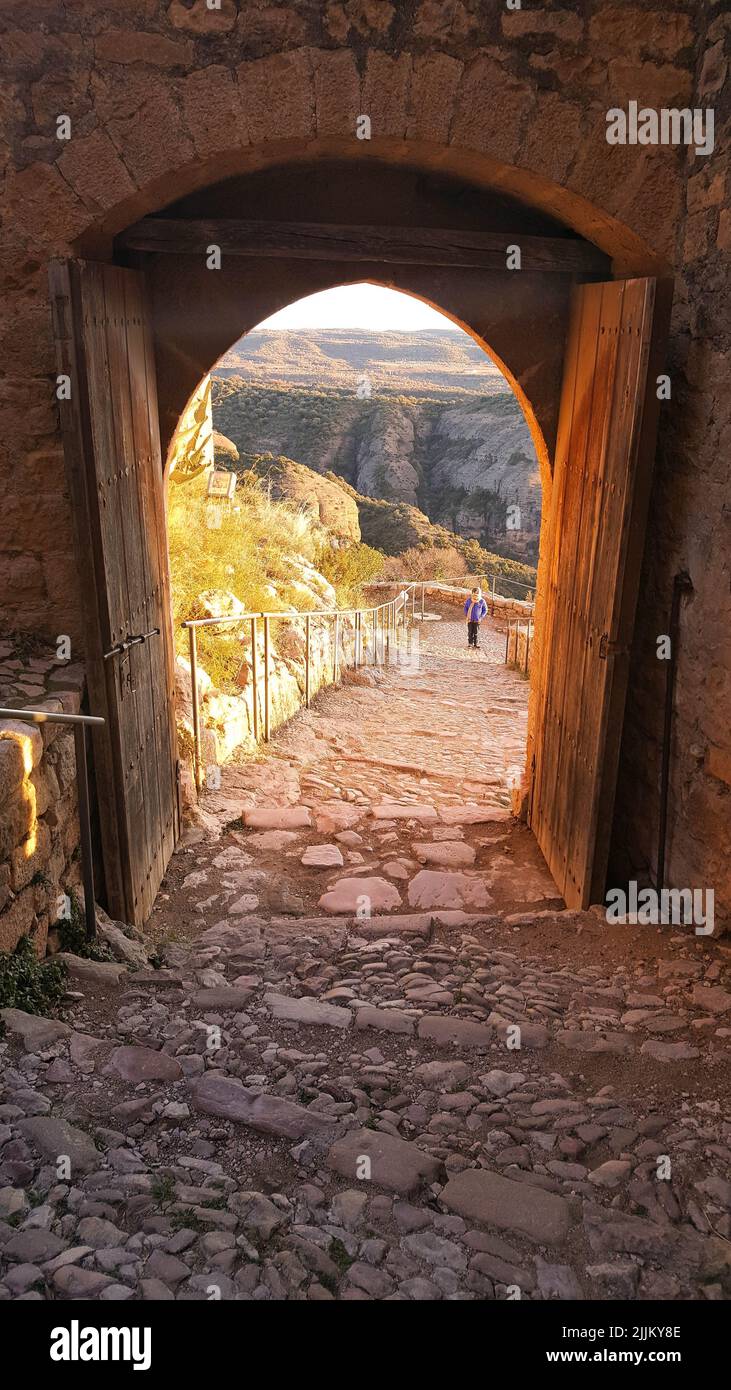 A vertical shot of a doorway in the shape of an arch on the mountain, Tarazona, Spain Stock Photo