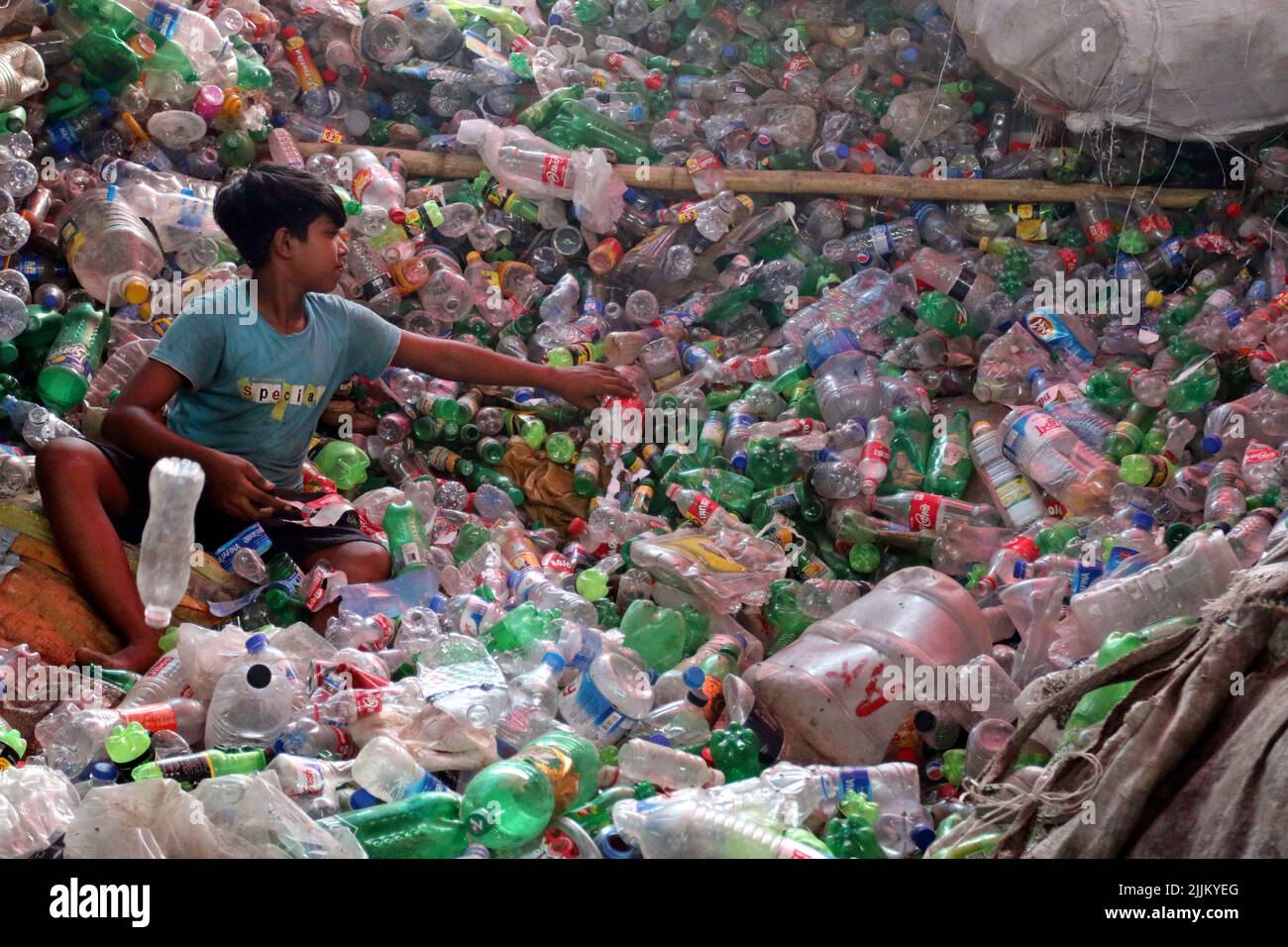 Works Work in a plastic bottle recycling factory in Dhaka, Bangladesh