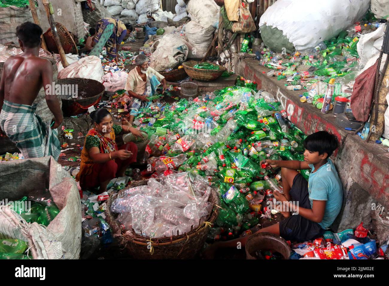 Works Work in a plastic bottle recycling factory in Dhaka, Bangladesh