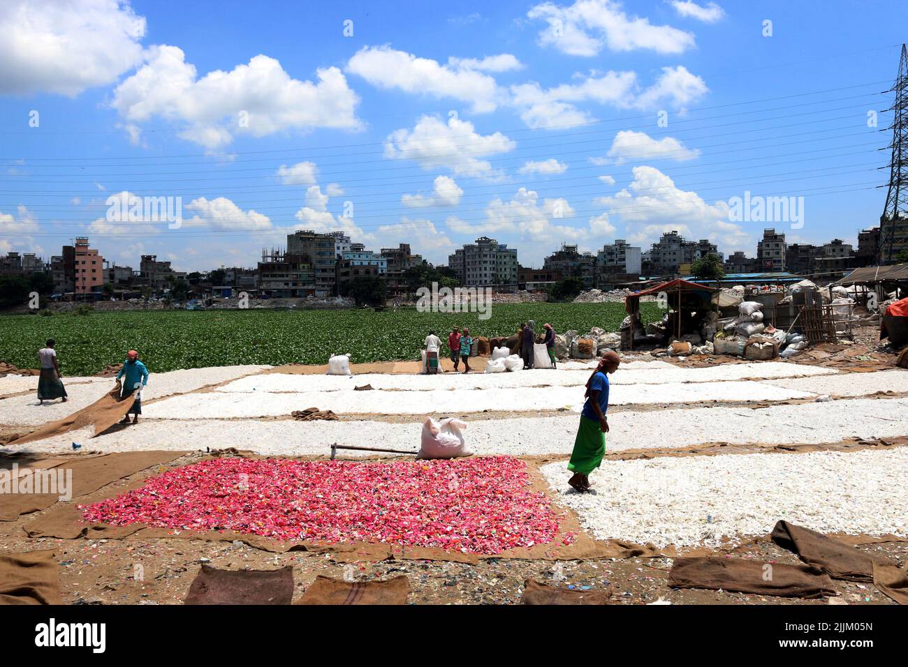 Works Work in a plastic bottle recycling factory in Dhaka, Bangladesh