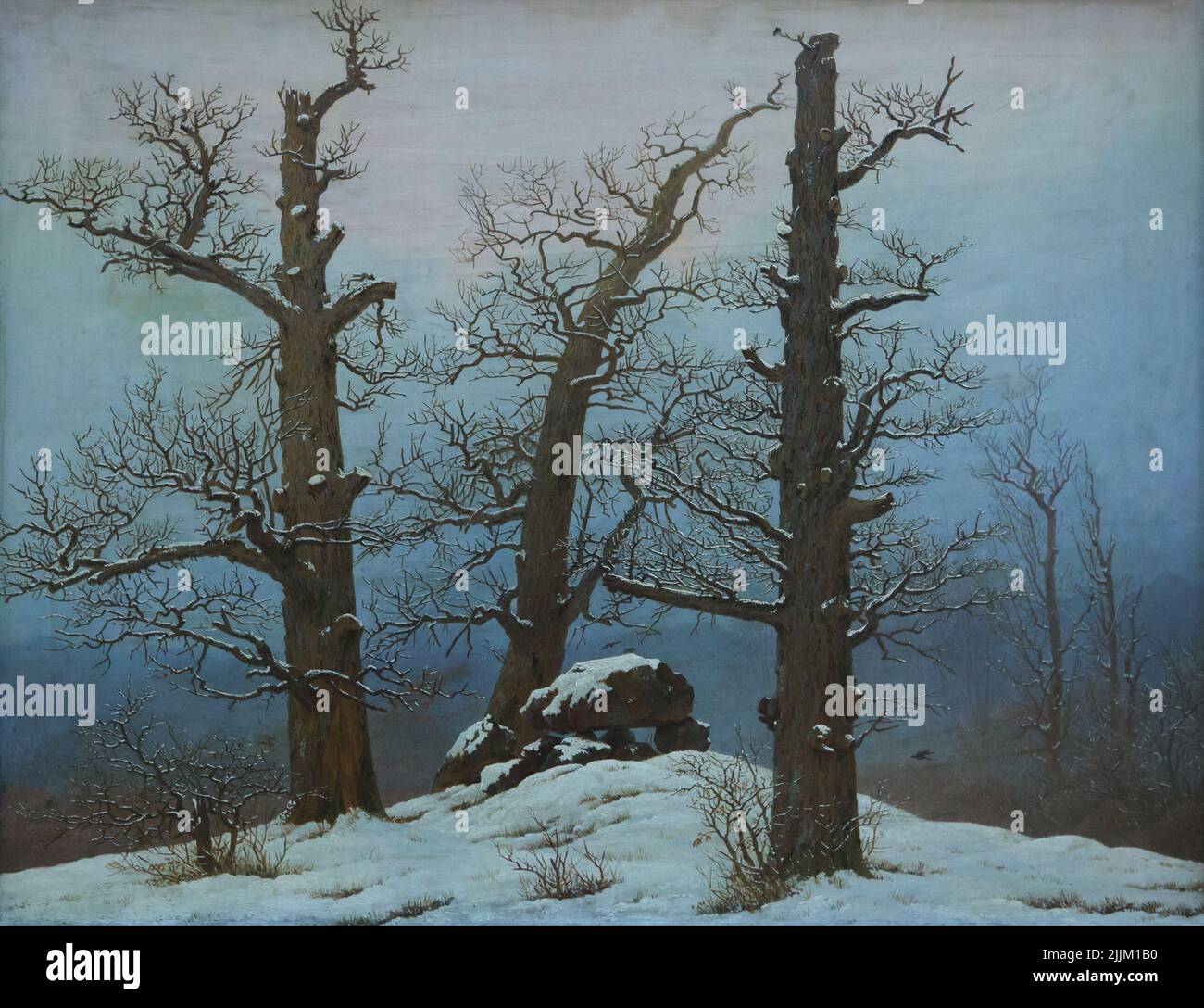Painting 'Dolmen under Snow' by German Romantic landscape painter Caspar David Friedrich (1807) on display in the Gаlеriе Nеuе Mеistеr (Nеw Маstеrs Gаllеry) in the Аlbеrtinum in Drеsdеn, Gеrmаny. Stock Photo